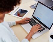 Woman at laptop creating web copy