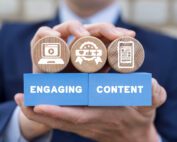 Man holding colorful blocks with icons and inscription: ENGAGING CONTENT. Concept of business marketing and engaging content. Web content marketing success, social media sharing, lead generation.
