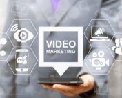 Person holding phone and watching videos.