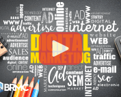 A chalkboard with "Digital Marketing" highlighted and surrounded by related terms like SEO, SEM, and advertisement, with pencils and a calculator nearby.