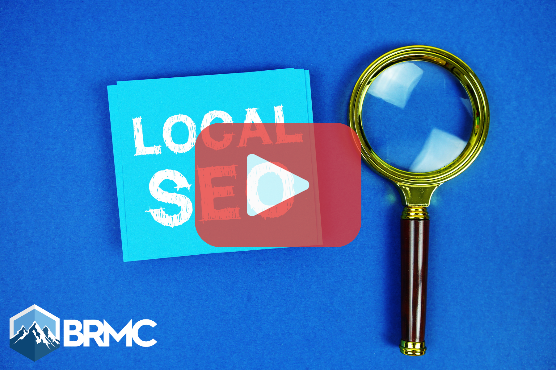 A blue card with the words “LOCAL SEO” next to a magnifying glass, symbolizing search optimization.
