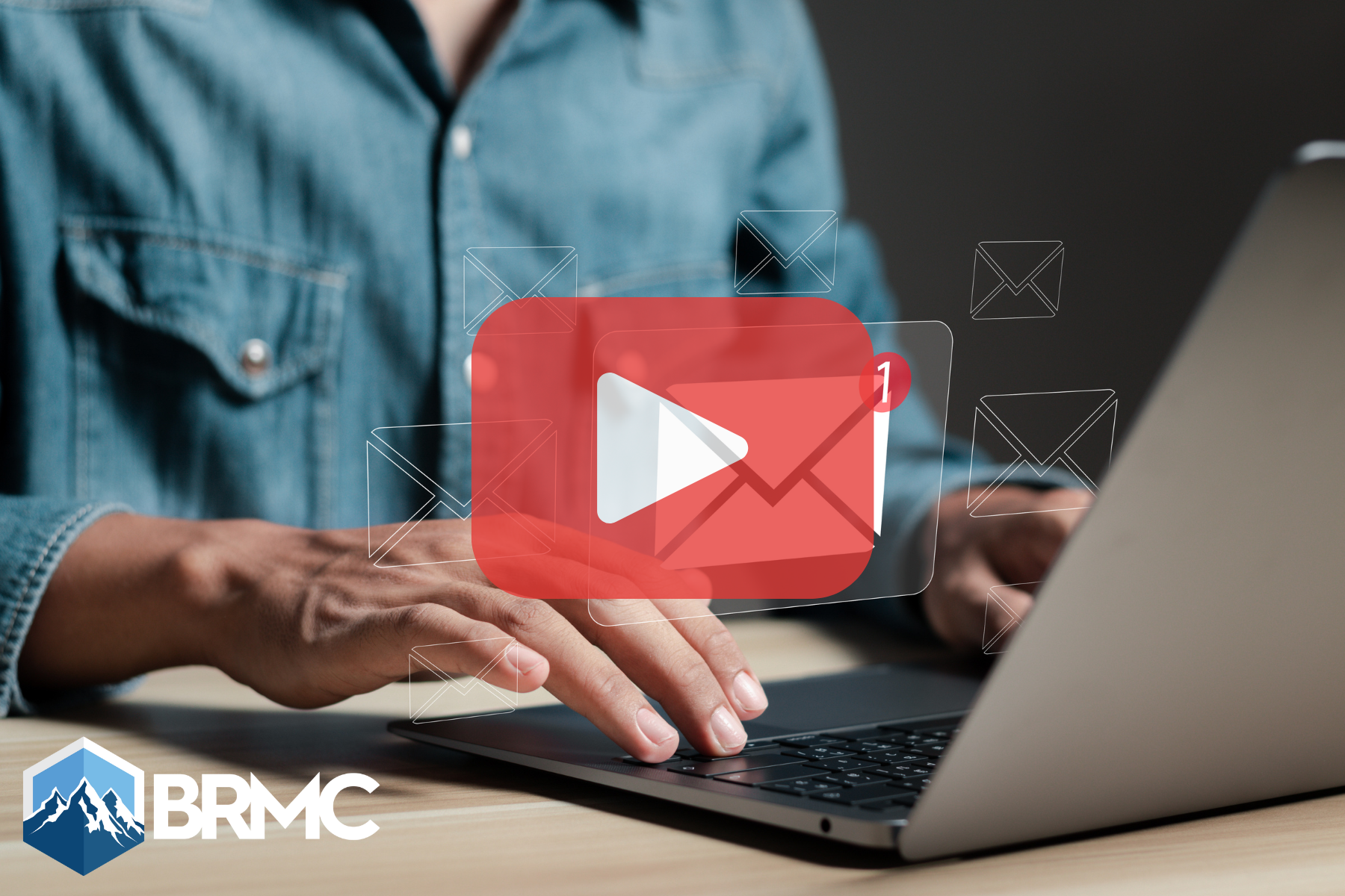 A person typing on a laptop with digital email icons and a large play button overlay, representing email marketing and communication.