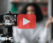Woman recording video with phone and red play buttom ovverlay.