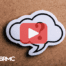 Question mark- Red play buttom overlay and BRMC logo.