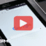 Tablet with google searxh on screen. Red play button overlay and BRMC logo.