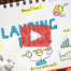 Notebook page with words: Landing Page and images. Red play buttom overlay and BRMC.